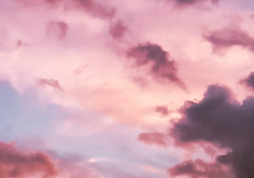 Clouds in the sky with a pink hue.