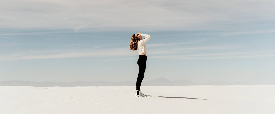God's Goodness - Person standing in desert.